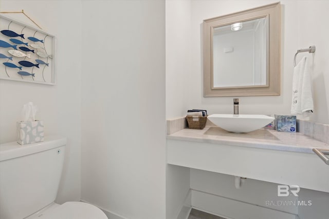 bathroom with toilet and vanity
