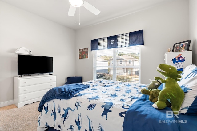 carpeted bedroom featuring ceiling fan