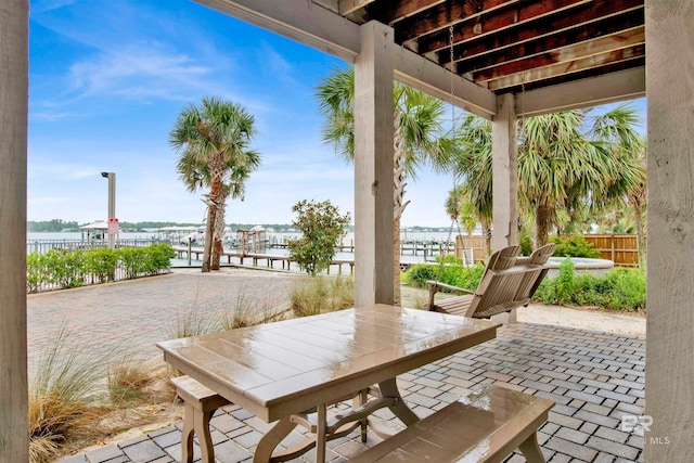 view of patio featuring a water view