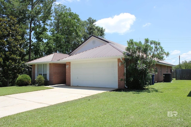 ranch-style house featuring a garage, a front yard, and central AC