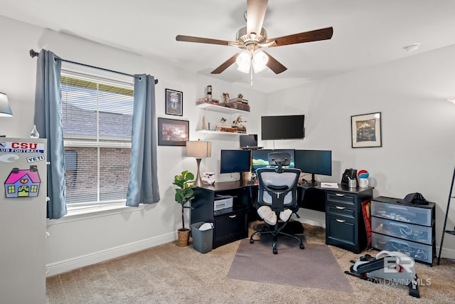 carpeted home office with ceiling fan