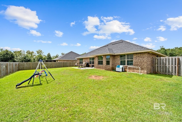 view of yard with a patio area and a playground