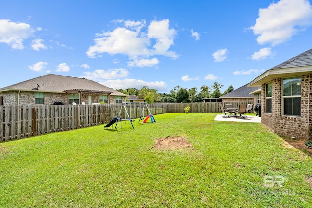 view of yard with a playground and a patio