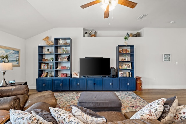 living room with dark wood-type flooring and vaulted ceiling