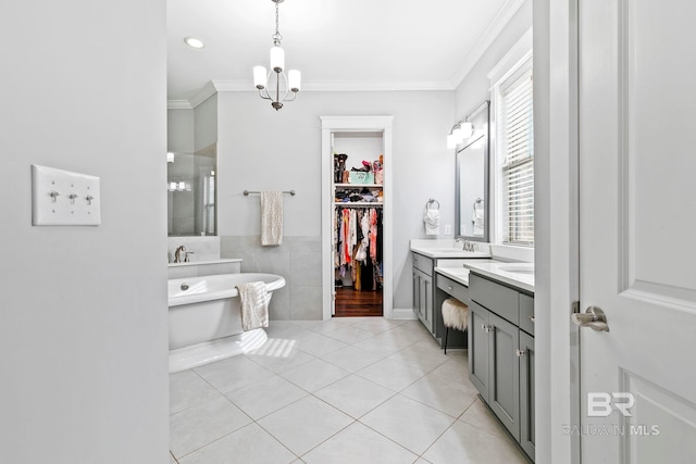 bathroom with tile patterned flooring, independent shower and bath, vanity, crown molding, and a notable chandelier