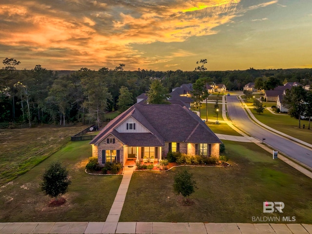 view of front of house featuring a porch and a lawn