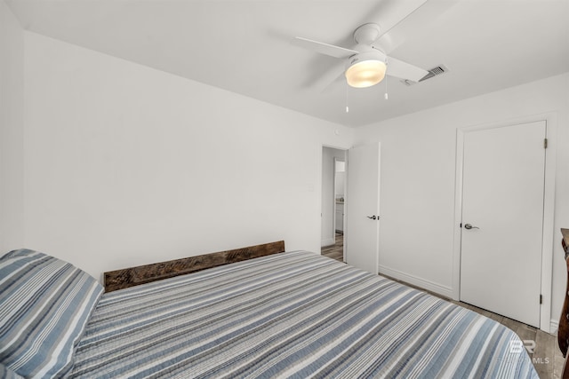 unfurnished bedroom featuring hardwood / wood-style flooring and ceiling fan