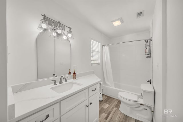 full bathroom featuring shower / bathtub combination with curtain, vanity, wood-type flooring, and toilet