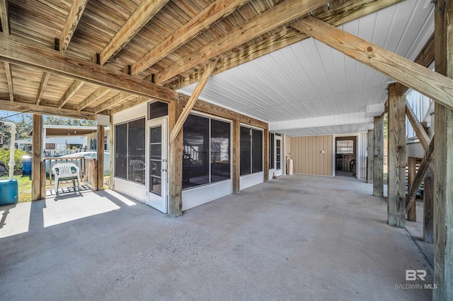 view of patio with a sunroom