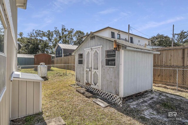 view of outdoor structure featuring a lawn