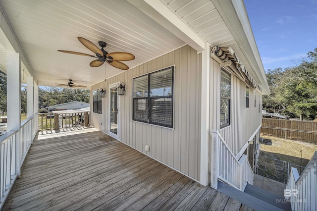 wooden terrace featuring ceiling fan and covered porch