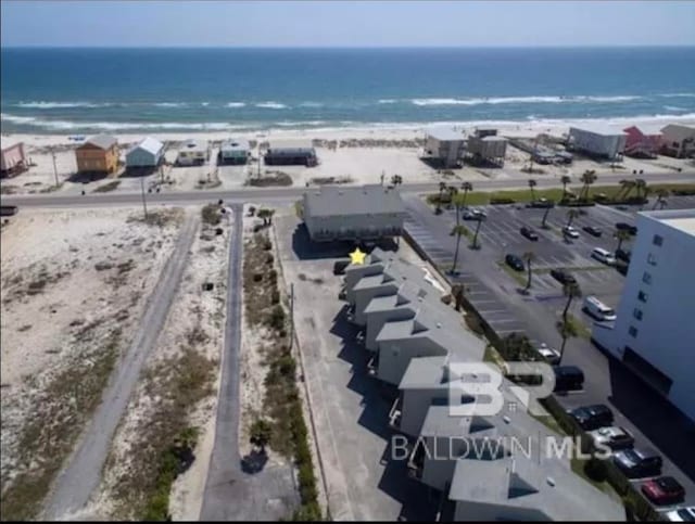 birds eye view of property featuring a water view and a view of the beach