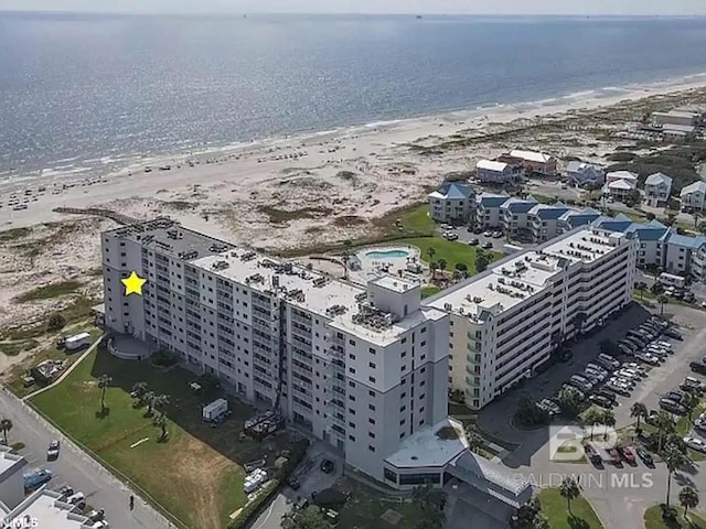 aerial view featuring a city view, a beach view, and a water view