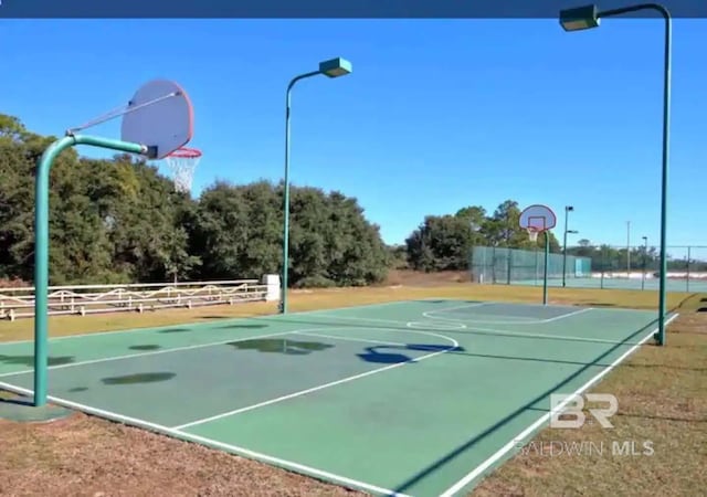 view of sport court with community basketball court and fence