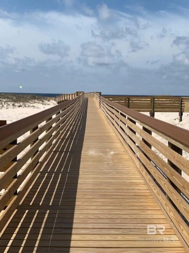 dock area featuring a view of the beach