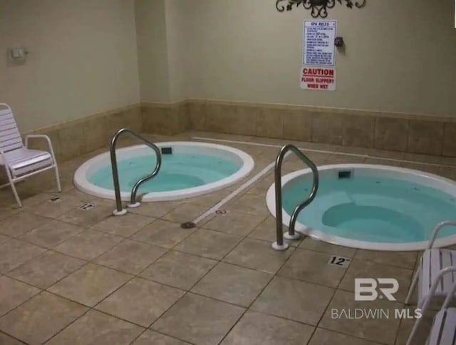 view of pool featuring an indoor hot tub