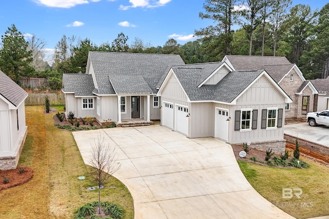 856 Geranium Dr, Fairhope, AL 36532 - modern farmhouse style home featuring an attached garage, a shingled roof, driveway, and board and batten siding