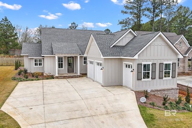 856 Geranium Dr, Fairhope, AL 36532 - modern farmhouse featuring roof with shingles, board and batten siding, an attached garage, and driveway