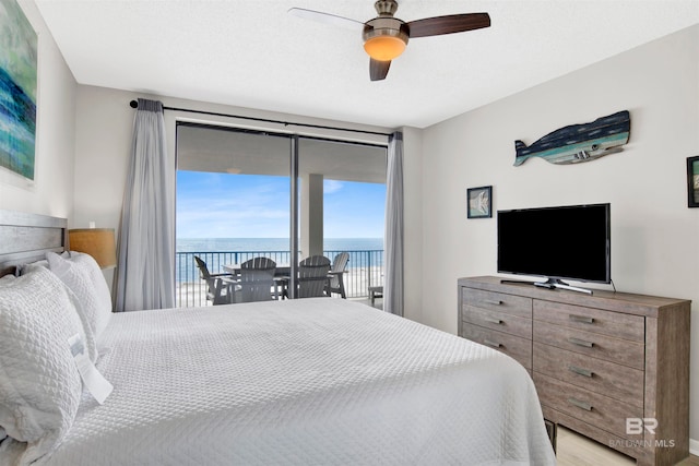 bedroom with access to outside, ceiling fan, and light hardwood / wood-style floors