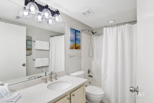 full bathroom with toilet, vanity, a textured ceiling, and shower / bath combo