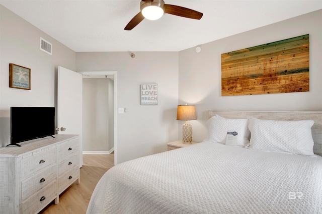 bedroom featuring ceiling fan and light hardwood / wood-style flooring