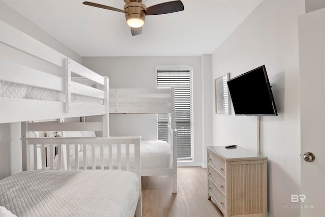 bedroom featuring ceiling fan and light wood-type flooring
