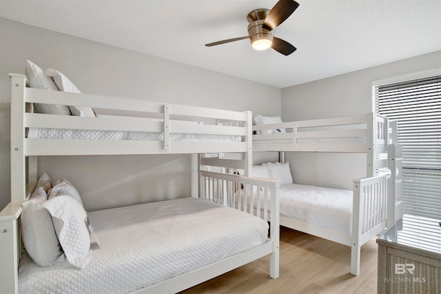 bedroom featuring ceiling fan and light hardwood / wood-style flooring