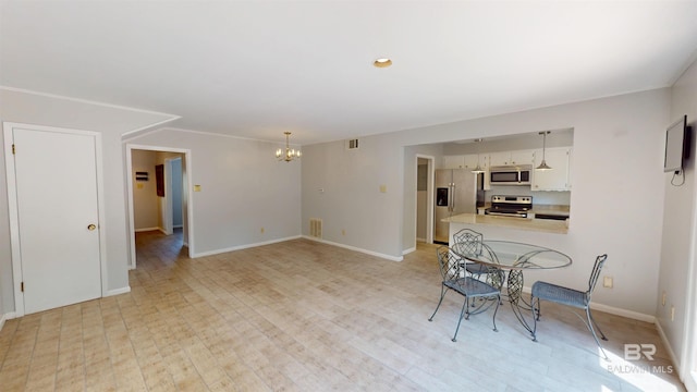 unfurnished dining area featuring baseboards, an inviting chandelier, light wood-style flooring, and visible vents