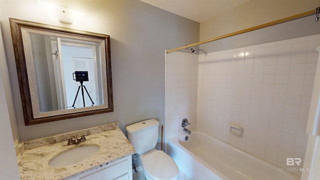 bathroom featuring shower / bathtub combination, toilet, and vanity