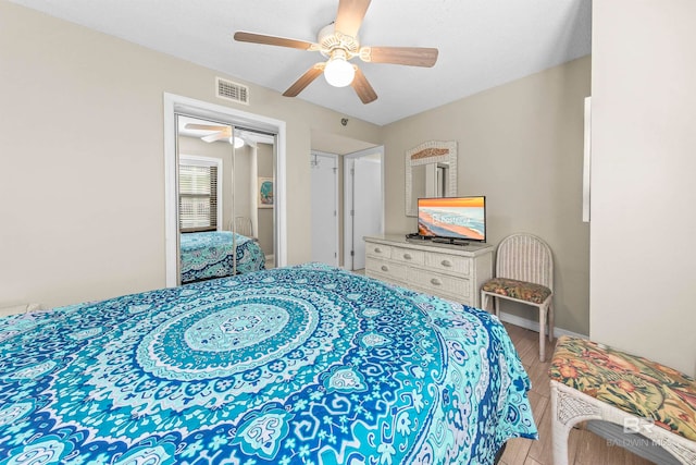 bedroom featuring a closet, ceiling fan, and hardwood / wood-style floors