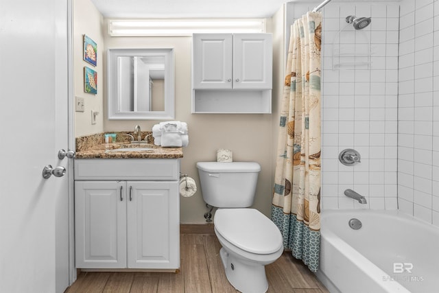 full bathroom with shower / bath combination with curtain, vanity, hardwood / wood-style floors, and toilet