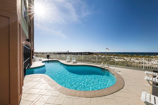 view of swimming pool featuring a patio