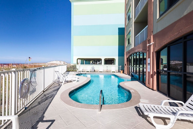 view of swimming pool featuring a patio area