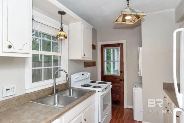 kitchen featuring white electric stove, white cabinetry, sink, and decorative light fixtures