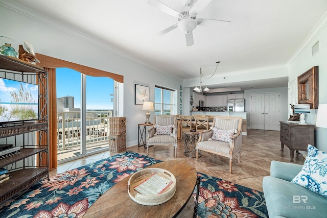 931 W Beach Blvd Unit 608, Gulf Shores, AL 36542 - living area featuring light tile patterned floors, ornamental molding, a ceiling fan, and baseboards