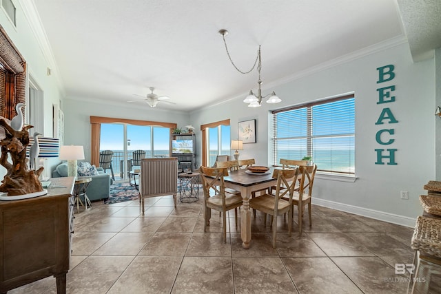 931 W Beach Blvd Unit 608, Gulf Shores, AL 36542 - dining space featuring crown molding, ceiling fan, plenty of natural light, baseboards, and a chandelier