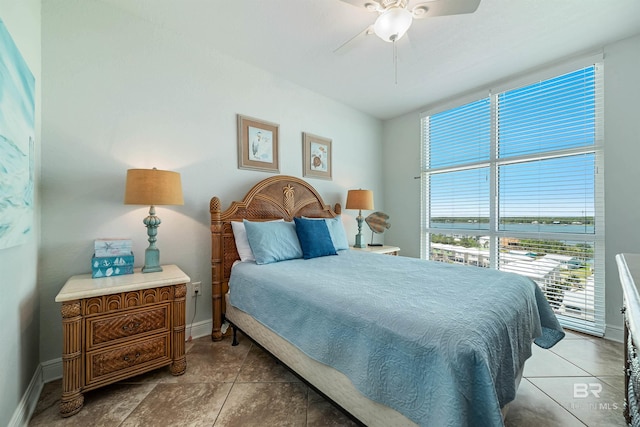 931 W Beach Blvd Unit 608, Gulf Shores, AL 36542 - tiled bedroom featuring baseboards and ceiling fan