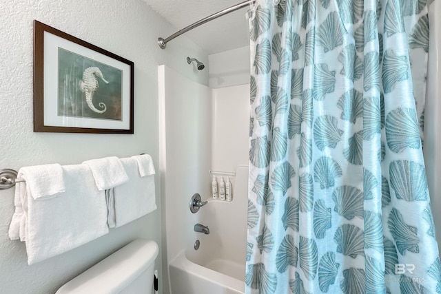 931 W Beach Blvd Unit 608, Gulf Shores, AL 36542 - full bathroom featuring shower / bath combination with curtain, toilet, and a textured wall