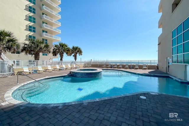 931 W Beach Blvd Unit 608, Gulf Shores, AL 36542 - view of pool featuring a pool with connected hot tub and a patio area