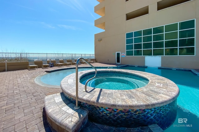 931 W Beach Blvd Unit 608, Gulf Shores, AL 36542 - community pool with a hot tub