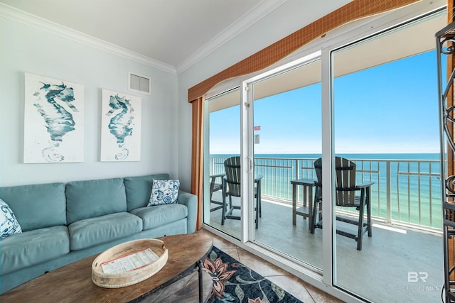 931 W Beach Blvd Unit 608, Gulf Shores, AL 36542 - tiled living room with ornamental molding and a water view