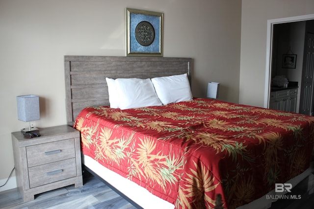 bedroom featuring hardwood / wood-style flooring