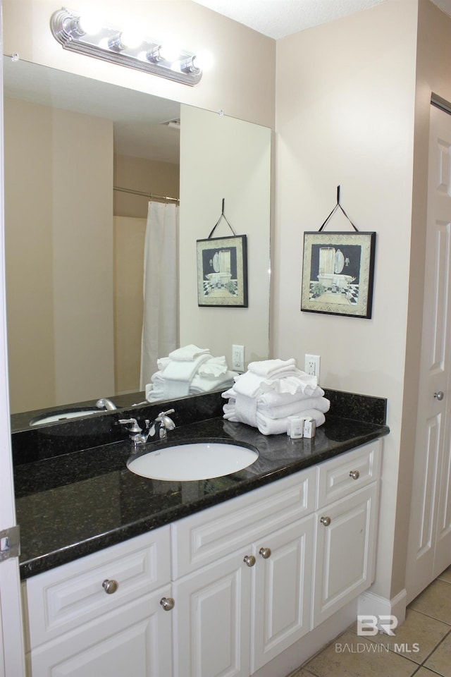 bathroom featuring vanity and tile patterned flooring