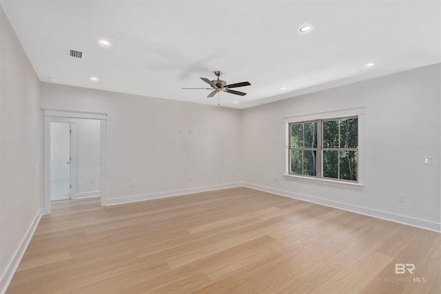 empty room with light hardwood / wood-style floors and ceiling fan