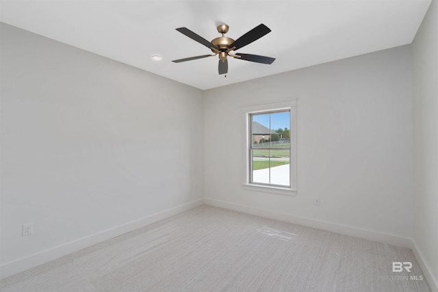 carpeted empty room with ceiling fan