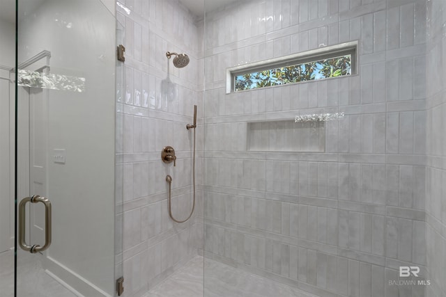 bathroom featuring an enclosed shower