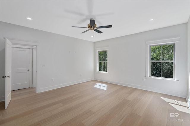 empty room featuring light wood-type flooring and ceiling fan