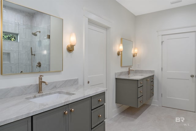 bathroom featuring vanity and tiled shower