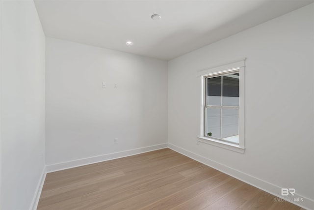 spare room featuring light wood-type flooring