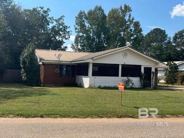 ranch-style house with a front lawn